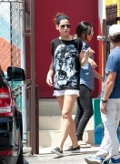 Sandra Bullock sported a black tank top with a roaring lion as she picked up her son Louis from school in Los Angeles 07/ 30/  2014